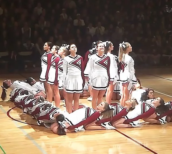 The optical illusion created by the drill team makes High School history.