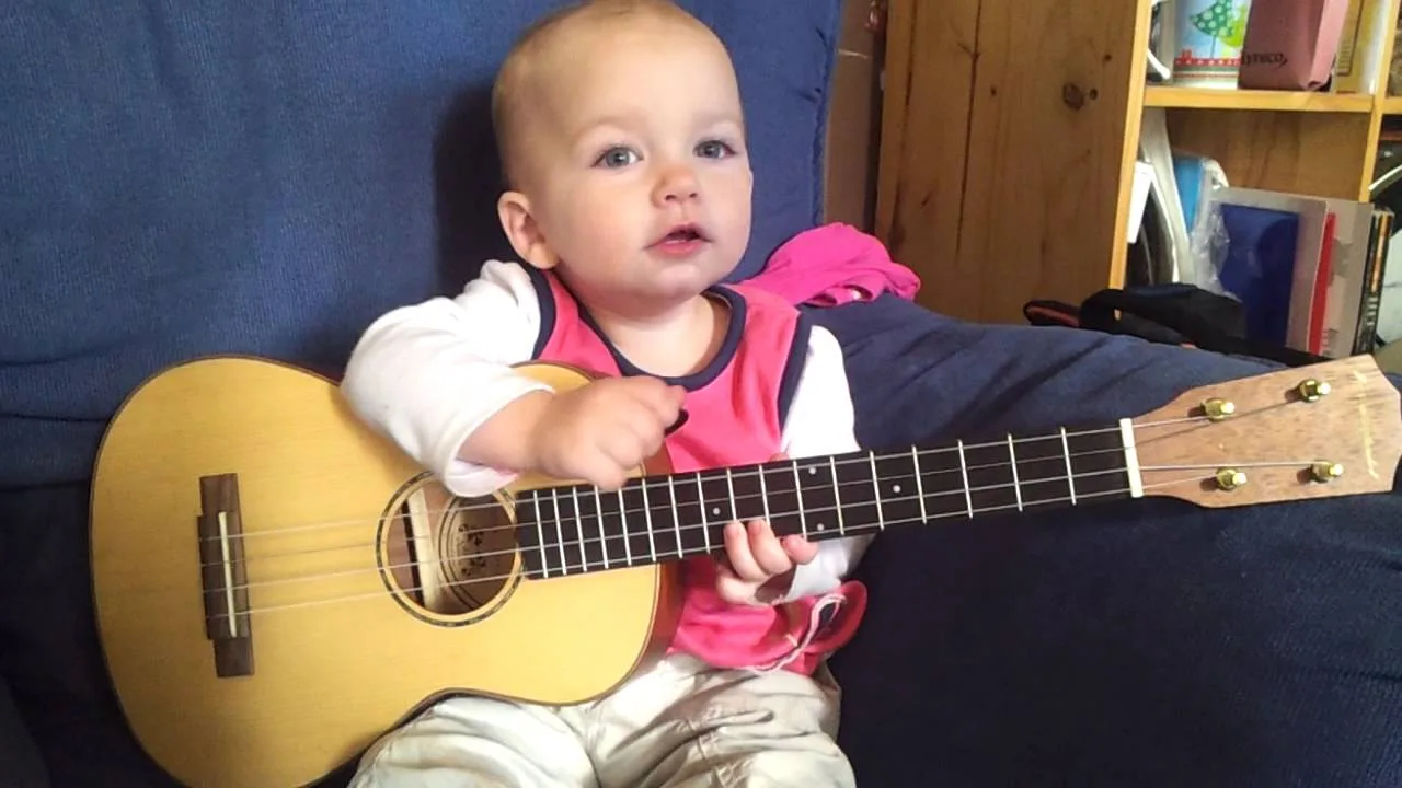 This baby is only one year old and plays the guitar
