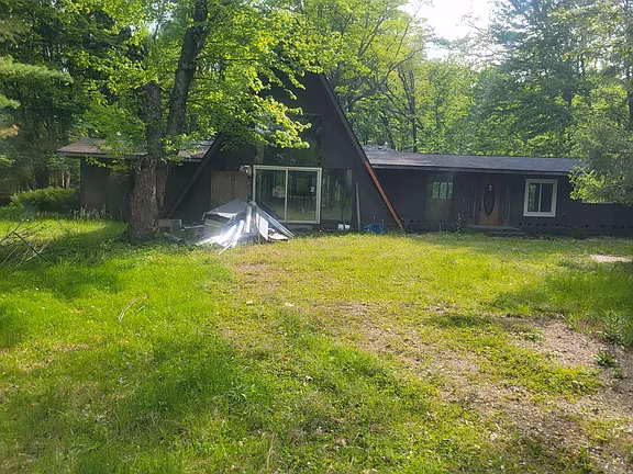 Secluded Riverfront Acreage with Rebuild Potential